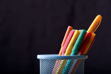 Color Magic in a metal box on a black background in classroomの写真素材