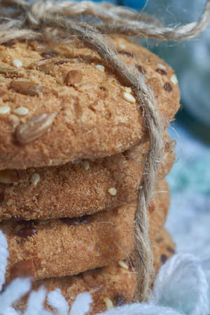 Tasty Cookies with sesame and sunflower seeds on plaid. Healthy eating