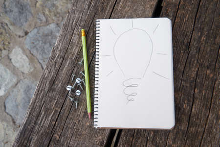 Blank notebook on wooden table background, business conceptの写真素材