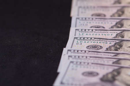 a pile of American paper hundred-dollar bills as an element of the world financial system