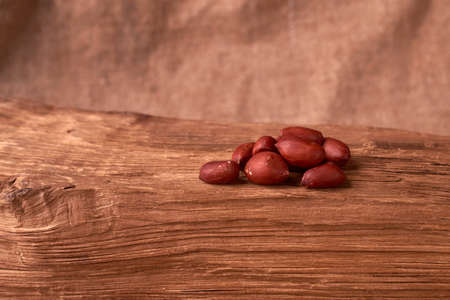 Peanuts on a wooden tableの写真素材
