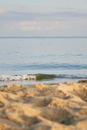 beautiful sandy beach and soft blue sea wave in summer