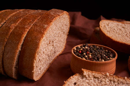 bowl of various pepper peppercorns seeds mix on rustic style background