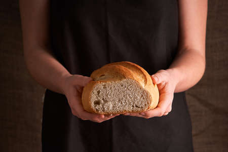 Bakery - gold rustic crusty loaves of bread and buns on black chalkboard background