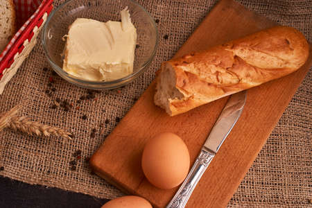 Bakery - gold rustic crusty loaves of bread and buns on black chalkboard background