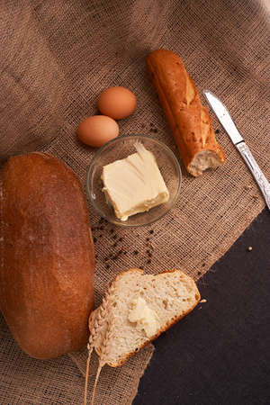 Top view of sliced wholegrain bread on dark ructic wooden background