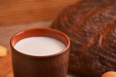 Assorted dairy products milk, cheese, eggs, rustic still lifeの写真素材