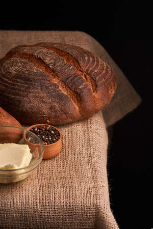 Peppercorns in a wooden bowl on table with food rustic style