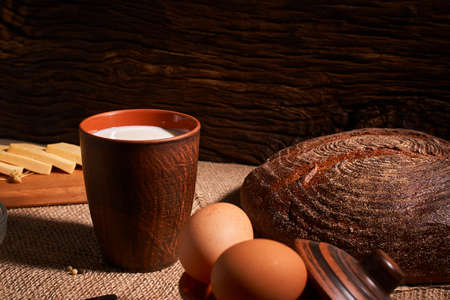 Assorted dairy products milk, cheese, eggs, rustic still lifeの写真素材
