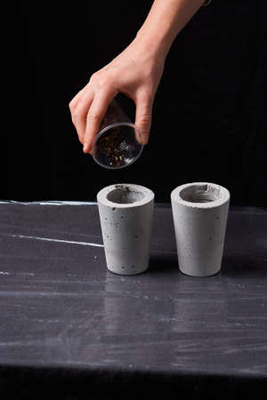 woman planting succulent in concrete pot. Ecology conceptの写真素材