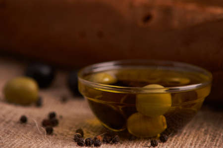 Fresh Italian baguette on wooden table with oil.Selective focusの写真素材