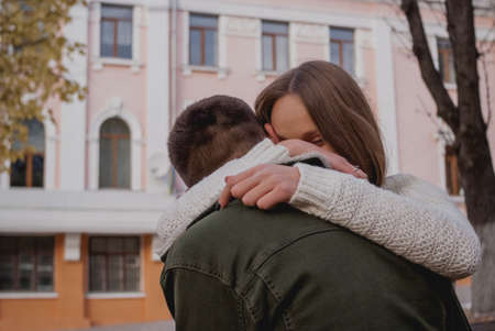 Happy young couple walking on a autumn day in the park.They are having fun together.の写真素材