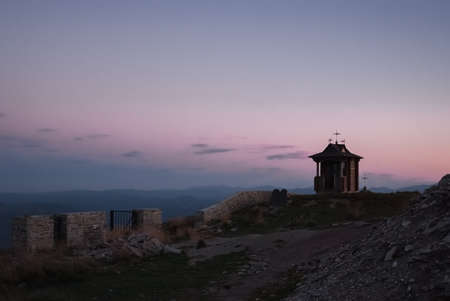 The mountains on a sunny day with clouds and coniferous forestの写真素材