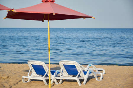 beds and umbrella on a tropical beach