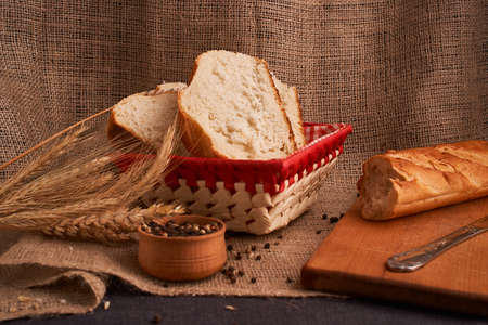 Bakery - gold rustic crusty loaves of bread and buns on black chalkboard background