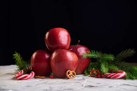 Candy and apples on the wooden background. New year foodの写真素材