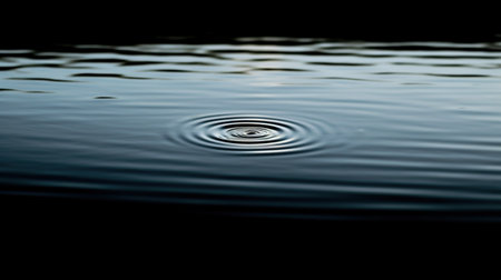 Photo for drop of water on the surface of the water with ripples and waves - Royalty Free Image