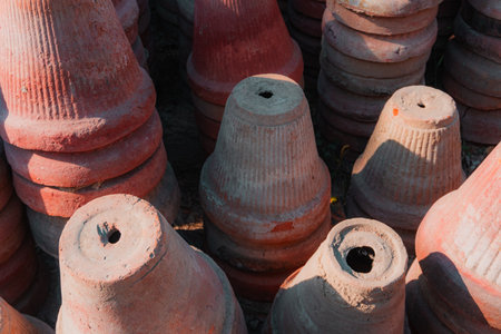 Stack of red clay pots for decoration in the park, Thailand.の写真素材