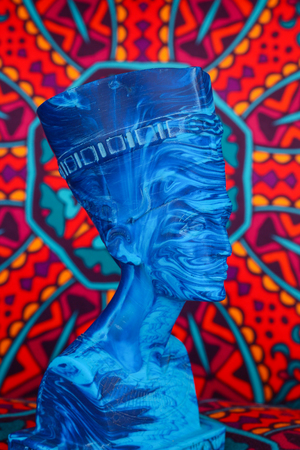 Ancient Egyptian Pharaoh Statue on colorful Artistic background / Ancient Egyptian pharaoh Statue on colorful oriental patternのeditorial素材