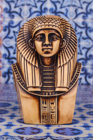 Ancient Egyptian Pharaoh Statue on colorful Artistic background / Ancient Egyptian pharaoh Statue on colorful oriental patternのeditorial素材