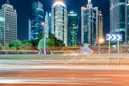 The light trails on the modern building background in shanghai china.のeditorial素材