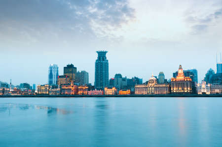 Shanghai historic architecture panorama at night lit by lights over Huangpu Riverのeditorial素材