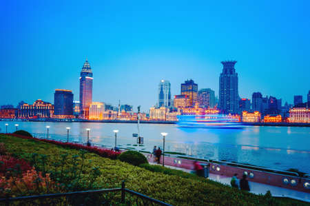 Shanghai historic architecture panorama at night lit by lights over Huangpu Riverのeditorial素材