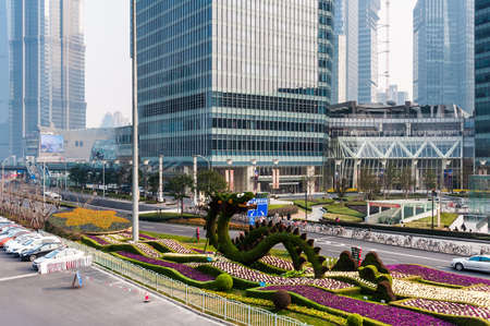 SHANGHAI - FEBRUARY 24: skyscrapers and street on February 24, 2013 in Shanghai. Shanghai is the largest city by population in the world with 23 million as in 2010.のeditorial素材
