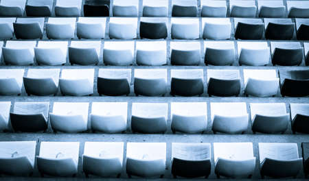 Empty plastic stadium seats in a rowの写真素材