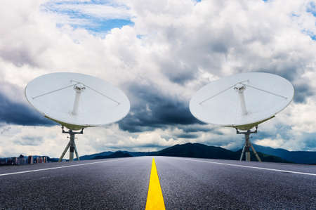 Satellite dish antenna on sides of the roadの写真素材
