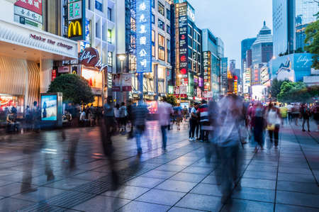 SHANGHAI, CHINA-SEPTEMBER 7:Tourists walk around Nanjing Road in Shanghai on September 7, 2013. Nanjing Road is the main shopping street of Shanghai and is one of the world's busiest shopping streets.のeditorial素材