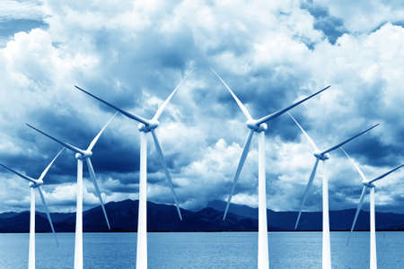 Green renewable energy concept - wind generator turbines in sky