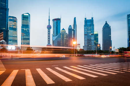 The light trails on the modern building background in shanghai china.