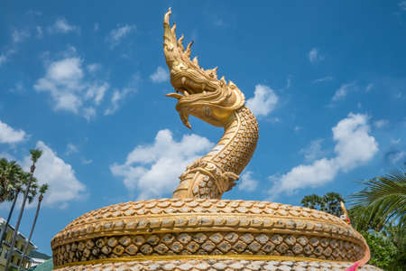 great naga statue in the park under blue skyの写真素材