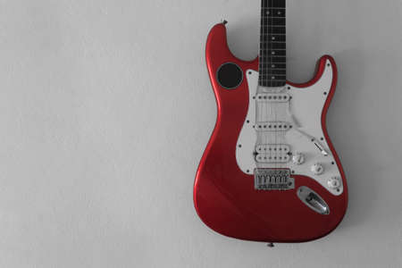 red guitar on the wallの写真素材