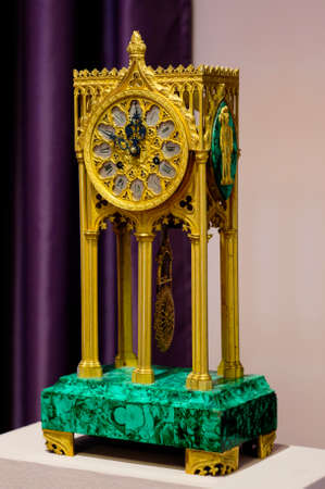 YAROSLAVL, RUSSIA - JUNE 30, 2016: A mantel clock in gothic style made in Western Europe in the end the XIX century. The mantel clock is located in The Foreign Art Museum in Yaroslavl.のeditorial素材