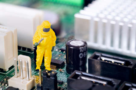 A toy technician is repairing and diagnosing a motherboard.の写真素材