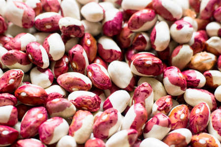 Lots of white and red beans. Selective focus.の写真素材