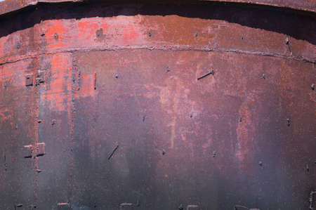 A texture of an old metallic rusted surface.の写真素材