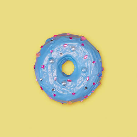 A photo of a donut, decorated with caramel, which looks like rhinestonesの写真素材
