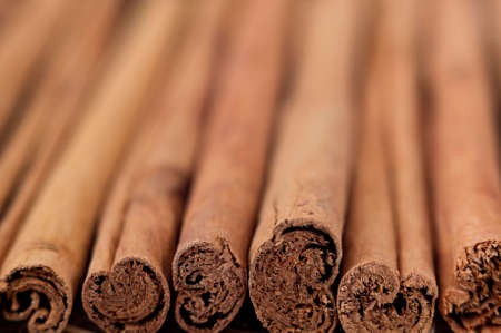 A background with cinnamon sticks. Selective focus on the bottom of the image.の写真素材