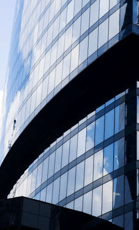 MOSCOW, RUSSIA - JULY 04, 2016: Clouds, sky and buildings are reflecting in the windows of Naberezhnaya Tower in Moscow International Business Center.のeditorial素材