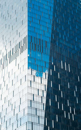 MOSCOW, RUSSIA - JULY 04, 2016: Clouds, sky and buildings are reflecting in the windows of Naberezhnaya Tower in Moscow International Business Center.のeditorial素材