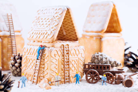 Photo of a christmas cookie house and toysの写真素材