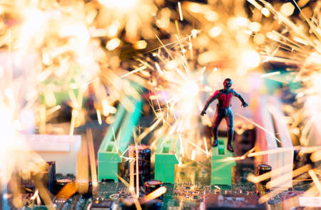 MAGNITOGORSK, RUSSIA - December 5, 2018: A figurine of running Ant-Man hero. Fictional character published in Maric Comics. ". The explosion effect is created and created using sparklers. Illustrative editorial.のeditorial素材