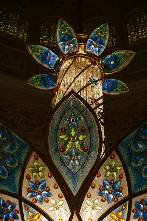 Close-up of one of the exquisite chandeliers inside the Sheikh Zayed Grand Mosque, adorned with millions of Swarovski crystals.の写真素材
