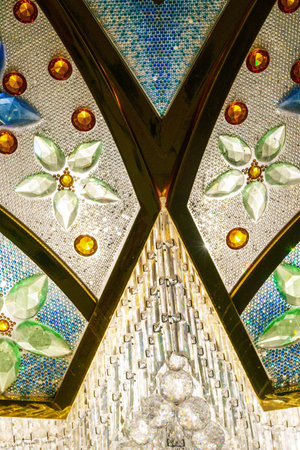 Close-up of one of the exquisite chandeliers inside the Sheikh Zayed Grand Mosque, adorned with millions of crystals.の写真素材