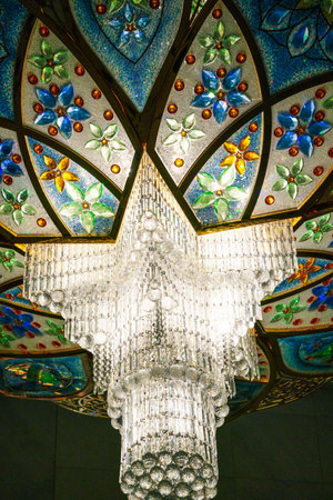 Close-up of one of the exquisite chandeliers inside the Sheikh Zayed Grand Mosque, adorned with millions of Swarovski crystals.の写真素材