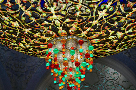 Close-up of one of the exquisite chandeliers inside the Sheikh Zayed Grand Mosque, adorned with millions of Swarovski crystals.の写真素材