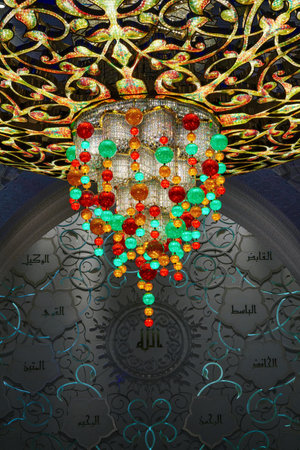 Close-up of one of the exquisite chandeliers inside the Sheikh Zayed Grand Mosque, adorned with millions of Swarovski crystals.の写真素材